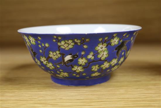 A Chinese blue ground prunus and blackbird bowl, bearing Qianlong mark to the base, diameter 14cm
